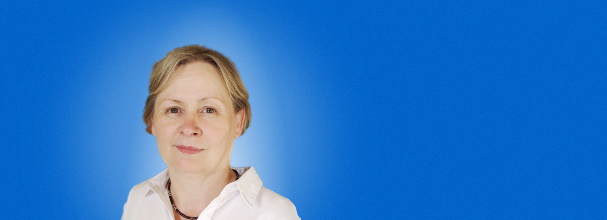 A portrait of Lesley McDonald against a blue background.